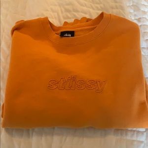 Orange Stussy crewneck sweatshirt